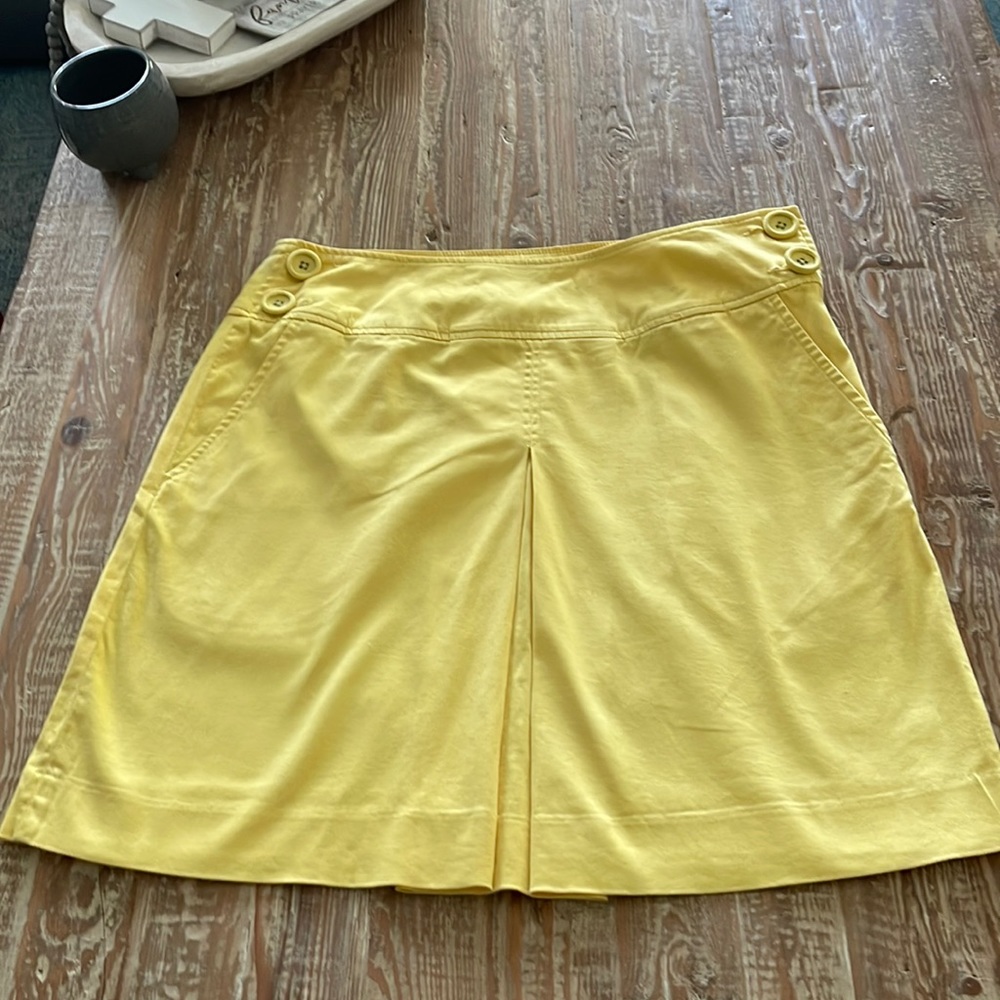 Yellow skirt with side buttons